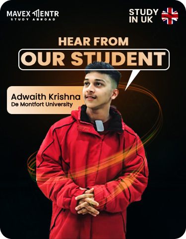 Person in red graduation gown holding diploma at ceremony