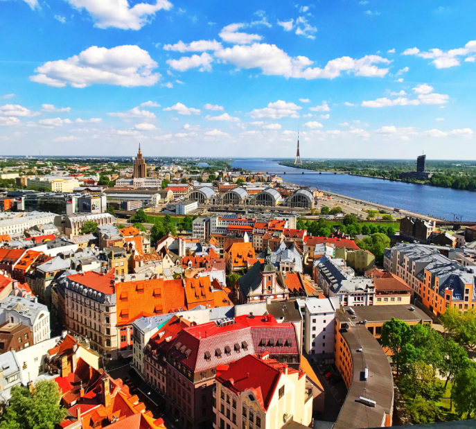 Aerial view of Prague with red-roofed historic buildings and architecture