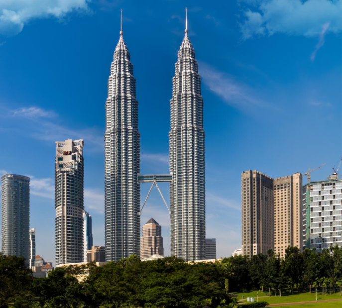 Petronas Twin Towers in Kuala Lumpur, Malaysia against blue sky