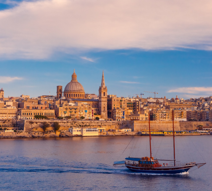 White Orthodox church with golden domes against blue sky