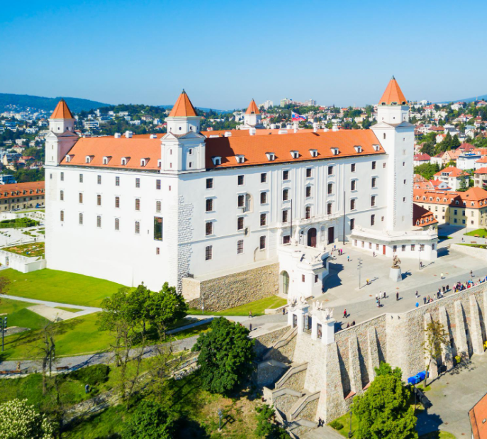 Historic monastery or palace complex with white walls and towers