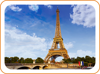 Eiffel Tower in Paris with tree-lined path in foreground