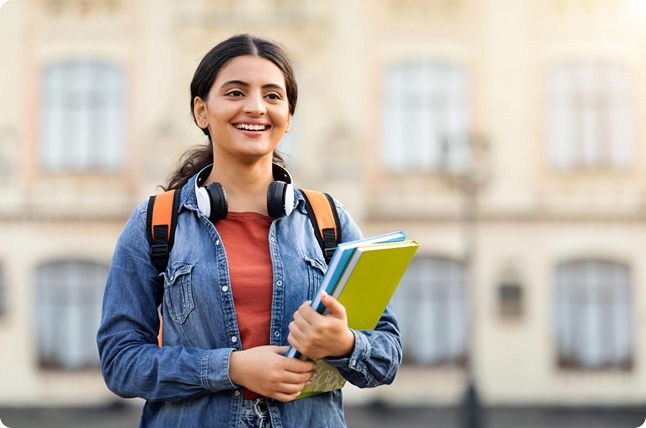 Student confidently walking on a university campus after planning study abroad journey
